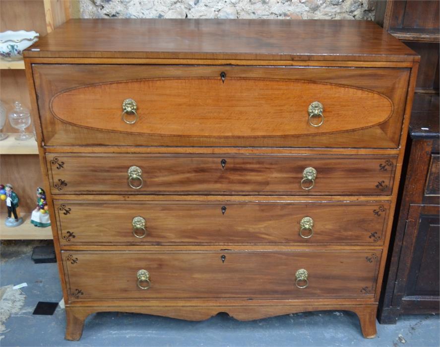 A George IV mahogany secretaire chest with well fitted interior over three long graduated drawers