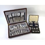 A cased set of six silver teaspoons with tongs, Sheffield 1921, a cased set of six coffee spoons,