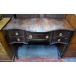A Victorian style cross-banded mahogany serpentine chest for a canteen of cutlery, raised on