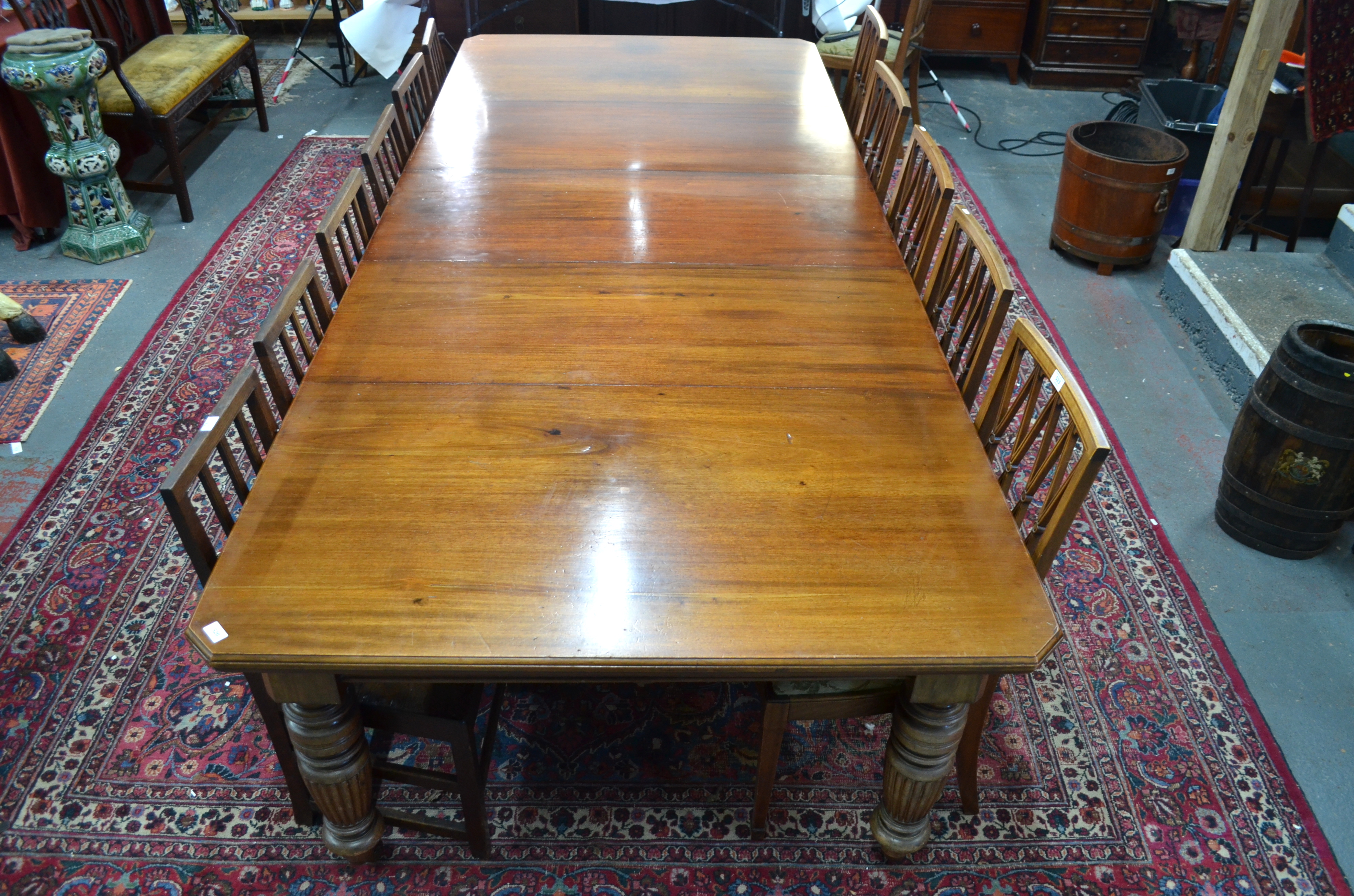 A late 19th century mahogany extending dining table, the rectangular top with moulded edges and