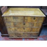 A late 17th century walnut chest of two short over three long graduated drawers, with brass ring