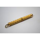 A 9ct yellow gold propelling toothpick with engraved decoration, approx 6.8g