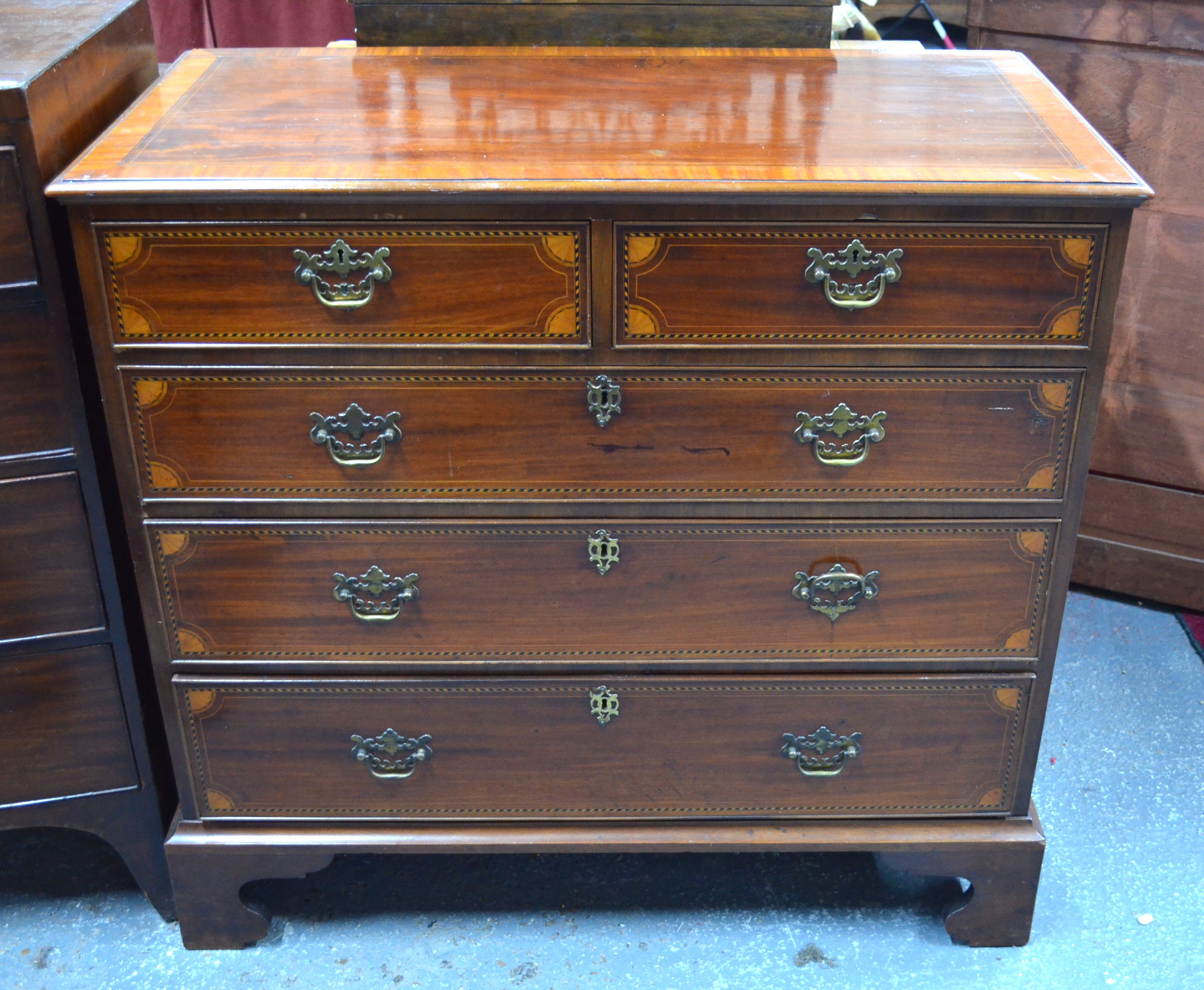 AMENDMENT 18TH CENTURY STYLE An 18th century cross-banded and chequer inlaid mahogany chest of two