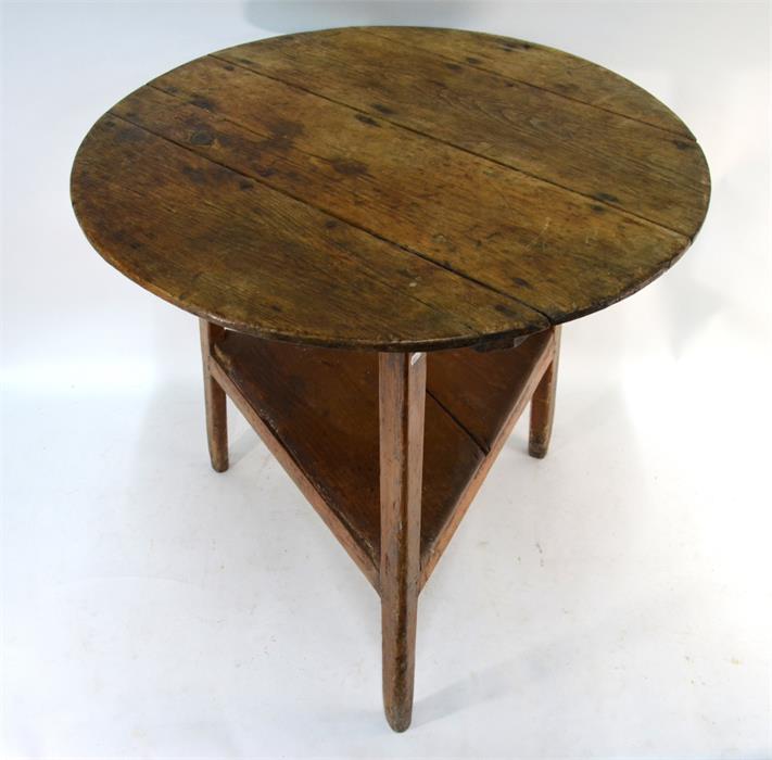 An 18th century pine cricket table, the circular plank top on chamfered square section legs united - Image 2 of 2