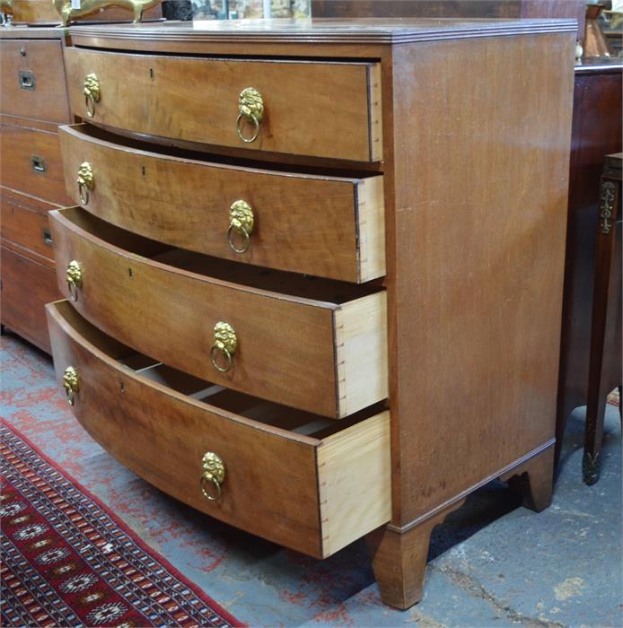 A 19th century bow front chest of four long graduated drawers with lion mask and ring handles, - Image 2 of 2