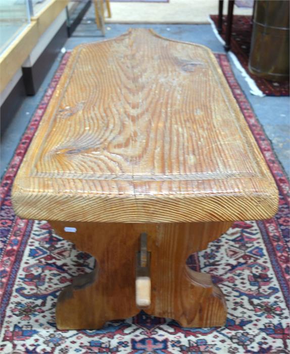 An antique oversized Swiss pine cheese board, later mounted and raised on a trestle base to form a - Image 2 of 3