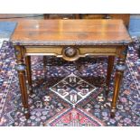 A Victorian oak fold over tea table, the rectangular top with moulded frieze and lobed corners