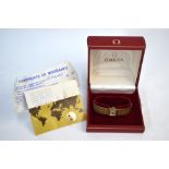 A boxed lady's 9ct gold Omega wristwatch with square dial and textured bracelet strap, 28.3 g