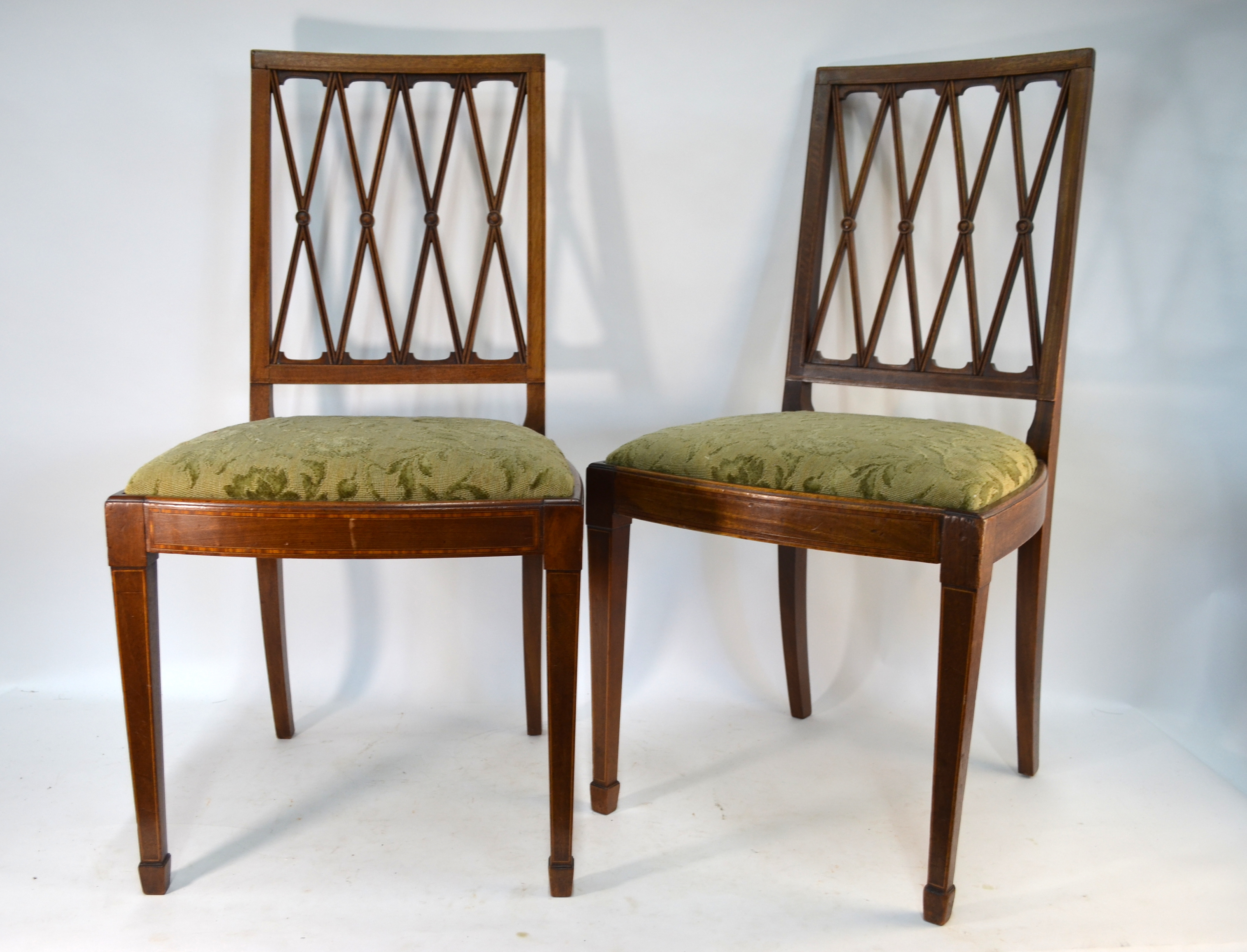 A set of six 19th century inlaid mahogany dining chairs with moulded lattice splats, bearing '