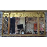 A Regency giltwood and composition triple plate overmantel with urn and swag moulded frieze over