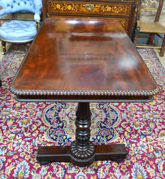 AMENDMENT - MAHOGANY A Victorian rosewood centre table, the well figured rectangular top with bead-