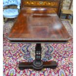 AMENDMENT - MAHOGANY A Victorian rosewood centre table, the well figured rectangular top with bead-