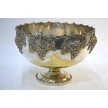 An epns large punch bowl with applied cast vine decoration, on stemmed foot, 37 cm diameter