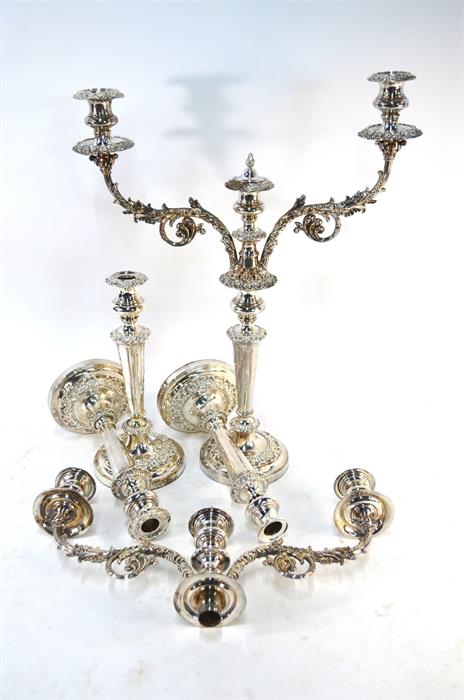 A pair of electroplated twin-branch candelabra with three sconces, on baluster pillars with - Image 2 of 2
