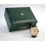 A gentleman's 9ct gold Rolex Precision wristwatch with silvered dial, gilt hands and chapters and