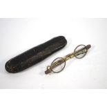 A pair of George III silver spectacles with folding telescopic arms, Joseph Willmore, Birmingham