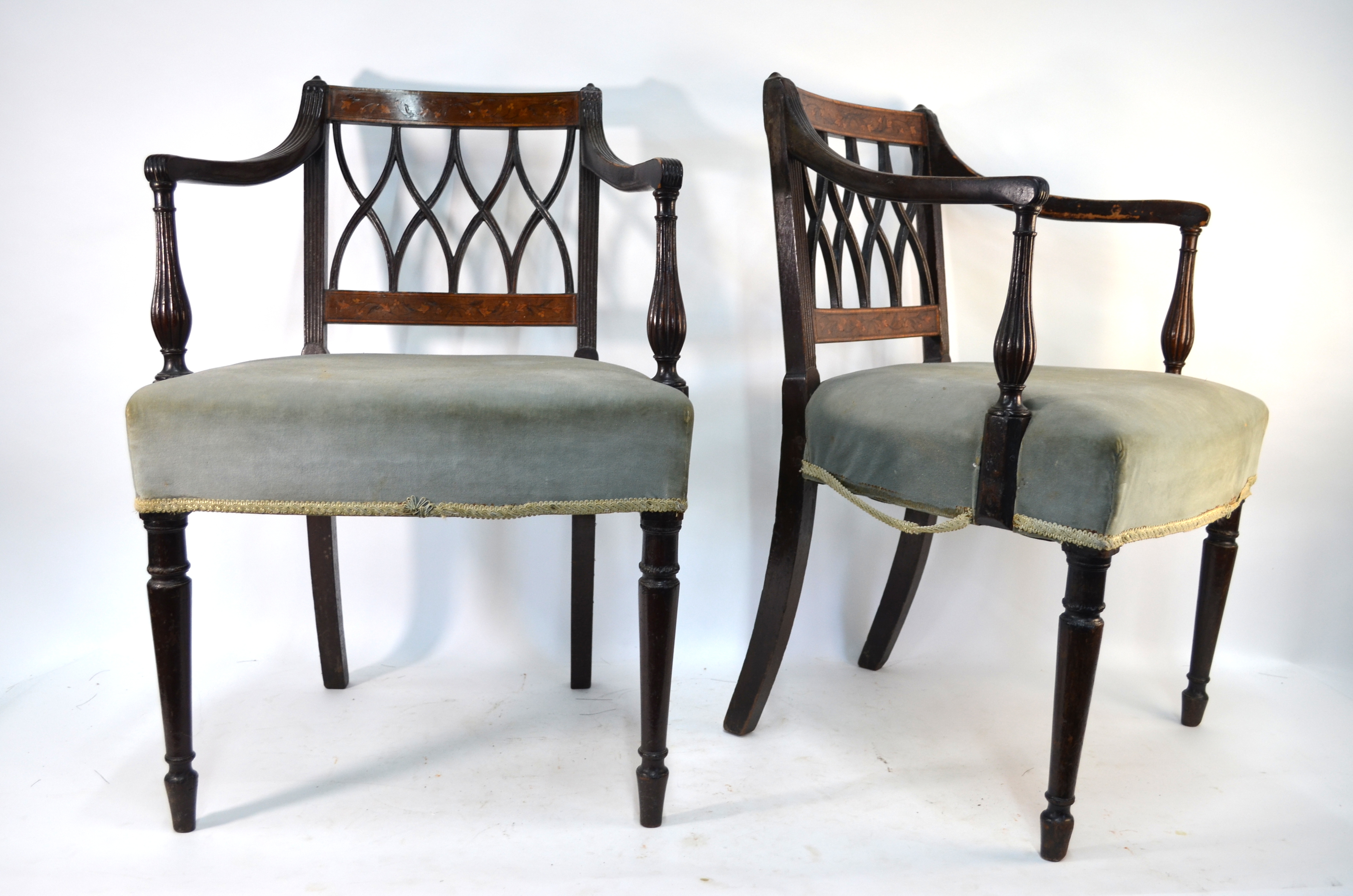 A pair of 19th century inlaid mahogany carved chairs with overstuffed seats (2)