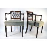 A pair of 19th century inlaid mahogany carved chairs with overstuffed seats (2)