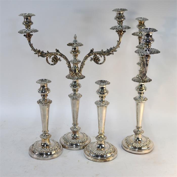 A pair of electroplated twin-branch candelabra with three sconces, on baluster pillars with