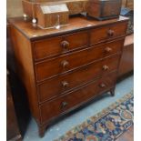A 19th century mahogany chest of two short over three long graduated drawers with original turned