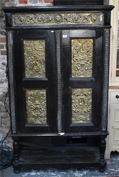 A late 17th/18th century and later jointed cabinet mounted with classical Bacchanalian style brass