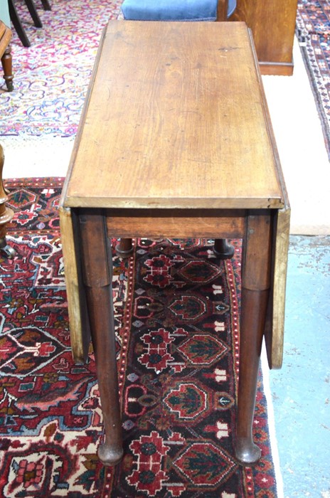 A Georgian mahogany drop leaf supper table raised on turned legs to pad feet - Image 3 of 4