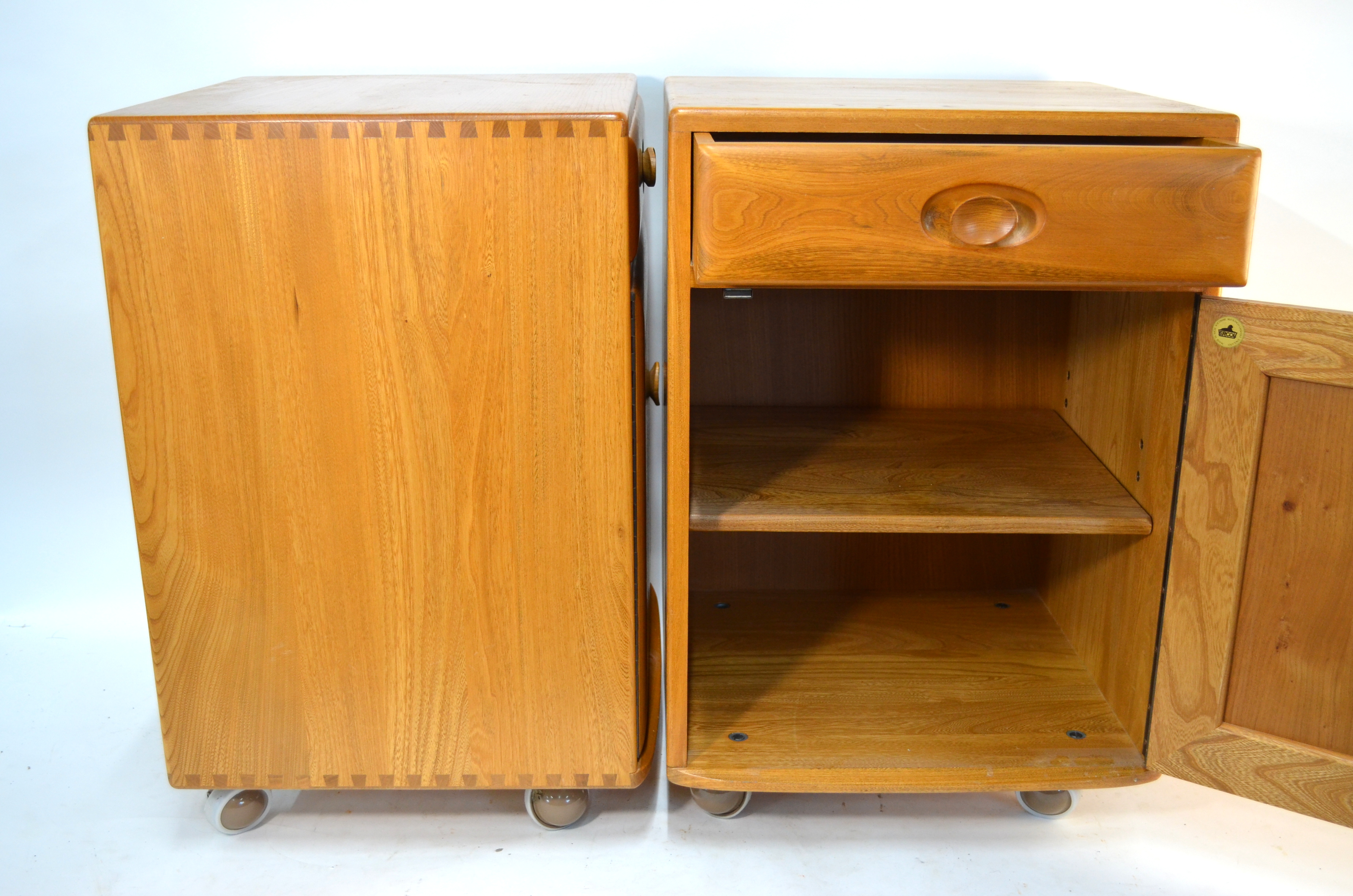 A pair of Ercol elm bedside cabinets on trademark castors, c. 1970's (2)Good condition - couple of - Image 6 of 7