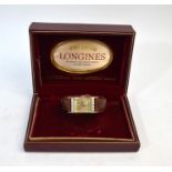 A vintage Longines boxed 14k wristwatch with diamond-set rectangular champagne dial with rows of