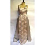 A 1950s ball gown oyster silk satin, floral and metallised thread brocade with structured bodice and