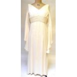 A 1970s ivory silk georgette wedding dress lined with silk satin lining with butterfly sleeves and
