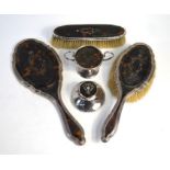 A silver, tortoiseshell and piqué-work three-piece brush and mirror set, London 1919, to/w a similar