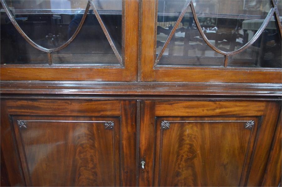 A Victorian mahogany library bookcase with a dentil moulded cornice over a pair of ovoid centred - Image 3 of 3