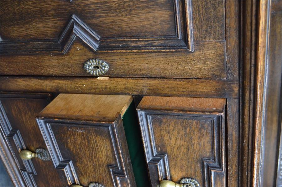 An oak mirror backed sideboard in the Carolean style, centred by three drawers flanked by cupboards, - Image 3 of 3