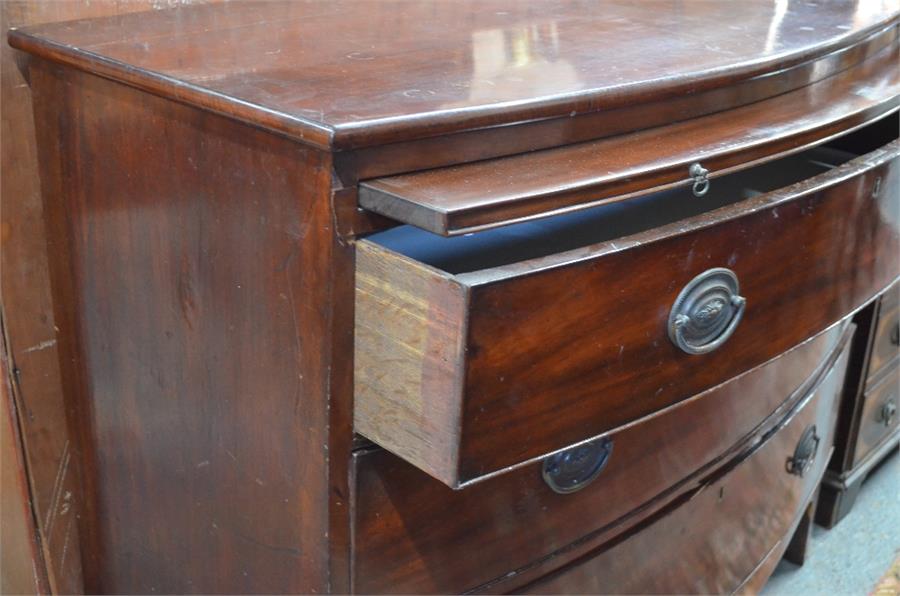 A 19th century bow front mahogany chest with brush slide over three long graduated drawers, raised - Image 2 of 3