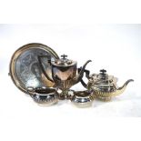A silver plated four piece tea set of shaped baluster form with fluted decoration comprising hot