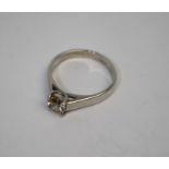 A contemporary 18ct white gold single stone ring set with circular brilliant-cut diamond in square