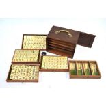 A bone and bamboo mah jong set with fitted teak box