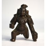 A small, Indian bronze figure of the young Krishna, holding the butterball with his right hand, 9 cm