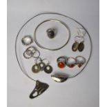 A collection of various contemporary silver and white metal jewellery items including a torque