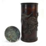 A Japanese cylindrical vessel of brushpot form, decorated in takabori with a dragon; the cylindrical