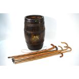 A coopered oak rum breaker, with Royal Coat of Arms transfer (as a stick stand) to/w a bundle of