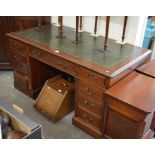 A mahogany twin pedestal desk with gilt tooled green leather top over nine drawers