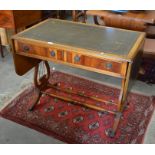 Yew wood lyre end drop leaf/sofa table with green leather top over two frieze drawers