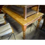 Large rectangular pine kitchen dining table raised on turned supports