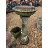 A large Victorian style cast stonecrete bird bath