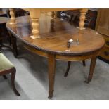 A mahogany oval wind-out dining table with single central leaf, raised on tapering square legs
