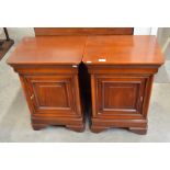 Pair of 'Brigitte Forestier' cherrywood bedside cabinets each having a moulded drawer ovr a panelled