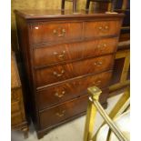 A George III mahogany chest of two short over four long graduated drawers - in two parts