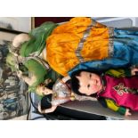 Three 1950s dolls comprising a large Indian costume doll, a Chinese doll with satin robe and hat