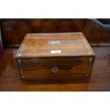 A wooden jewellery box inlaid with mother-of-pearl with lift-out tray